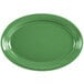 A green oval platter with a white background.