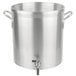 A large silver Vollrath Wear-Ever stock pot with metal handles and a faucet.