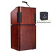 A wooden podium with a microphone and battery.