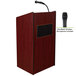 A mahogany wooden lectern with a microphone and speaker.