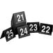 a black and white sign with white numbers