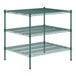 A green metal wire shelving unit with three shelves.