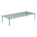 A Regency green wire shelf with 14" posts on a table.