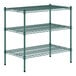 A green metal wire shelving unit with three shelves.