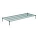 A Regency green wire shelf kit with black legs holding two green shelves.
