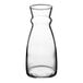 An Arcoroc clear glass carafe with a handle.