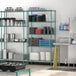 A kitchen with Regency metal wire shelving with dishes on the shelves.