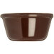 A close-up of a brown Carlisle ramekin.