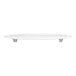 A white round Wilton cake separator plate with scalloped edges.
