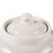 A white ceramic Hall China teapot with a lid.