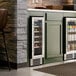 A single temperature full glass door commercial wine cooler built into a kitchen cabinet.
