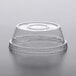 A clear Dome PET lid on a clear plastic container with a round bottom.