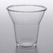 A clear 9 oz. PET parfait cup on a white surface.