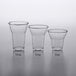 A group of clear plastic 9 oz. PET parfait cups.