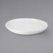 A Tuxton AlumaTux Pearl White pizza serving plate with a rim.