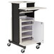 An Oklahoma Sound black and white presentation cart with a white shelf.
