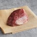 A Warrington Farm Meats frozen sirloin steak on a piece of paper.