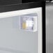 A close-up view of the interior light inside a Galaxy CRG-2 black customizable countertop display refrigerated merchandiser.
