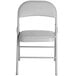 A gray Lancaster Table & Seating folding chair with a padded seat.