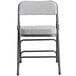 a grey and black folding chair