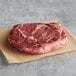 a raw steak on a paper