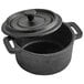 a black cast iron pot with a lid