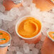 A close-up of Luigi's Orange Sherbet in a cup.