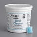 A white bucket with Noble Chemical bowl cleaner packs next to it.
