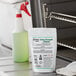 A white bag with green label containing Noble Chemical QuikPacks on a counter in a school kitchen.