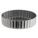 A silver round metal Vollrath tart pan with a ruffled edge.