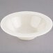 A Homer Laughlin ivory china bowl with a small rim on a white background.