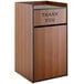 A wooden Lancaster Table & Seating waste receptacle enclosure with a "THANK YOU" swing door.