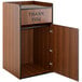 A Lancaster Table & Seating walnut wooden receptacle enclosure with a "THANK YOU" swing door.