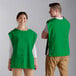 A man and woman wearing Choice Kelly Green cobbler aprons.