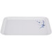 A white rectangular tray with a blue bamboo design on the border.