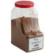A plastic container of brown Regal Big Flavor BBQ Seasoning.