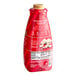 A red and white Torani bottle of Peppermint Bark flavoring sauce with white text.