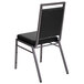 A Flash Furniture black vinyl banquet chair with a silver metal frame.