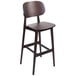 A BFM Seating Emma dark walnut wooden bar chair with a white backrest.