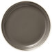 A close up of a Libbey Englewood matte olive porcelain plate with a white rim.