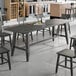 The Lancaster Table & Seating Industrial Slate Gray Finish Standard Height Trestle Table Base for a large rectangular table.