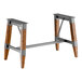 Lancaster Table & Seating industrial rustic walnut trestle table base with metal frame and wooden legs.