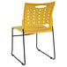 A yellow Flash Furniture stack chair with black legs.