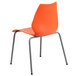 An orange plastic Flash Furniture stack chair with metal legs.