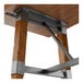 A Lancaster Table & Seating table with a trestle base and a rustic walnut top.