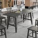 A Lancaster Table & Seating live edge table with chairs.
