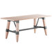 A Lancaster Table & Seating wooden table with legs.