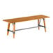 A Lancaster Table & Seating wooden table with metal trestle legs.