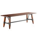 A Lancaster Table & Seating solid wood live edge dining table with legs.