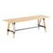 A Lancaster Table & Seating wooden table with metal legs.
